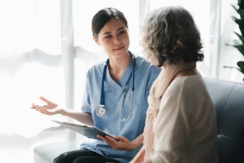 Nurse talking to patient in the healthcare field