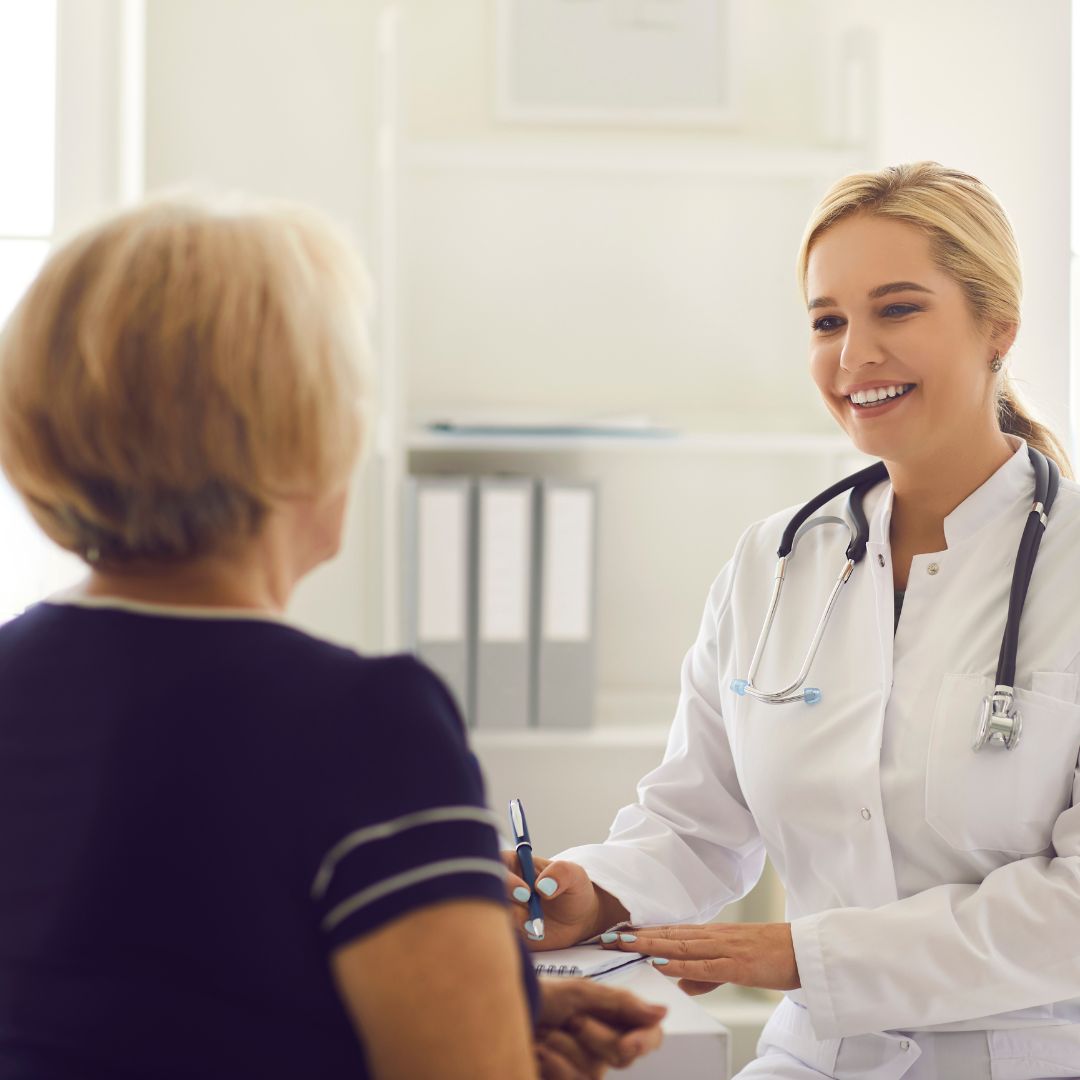 Image of a travel nurse talking to a patient