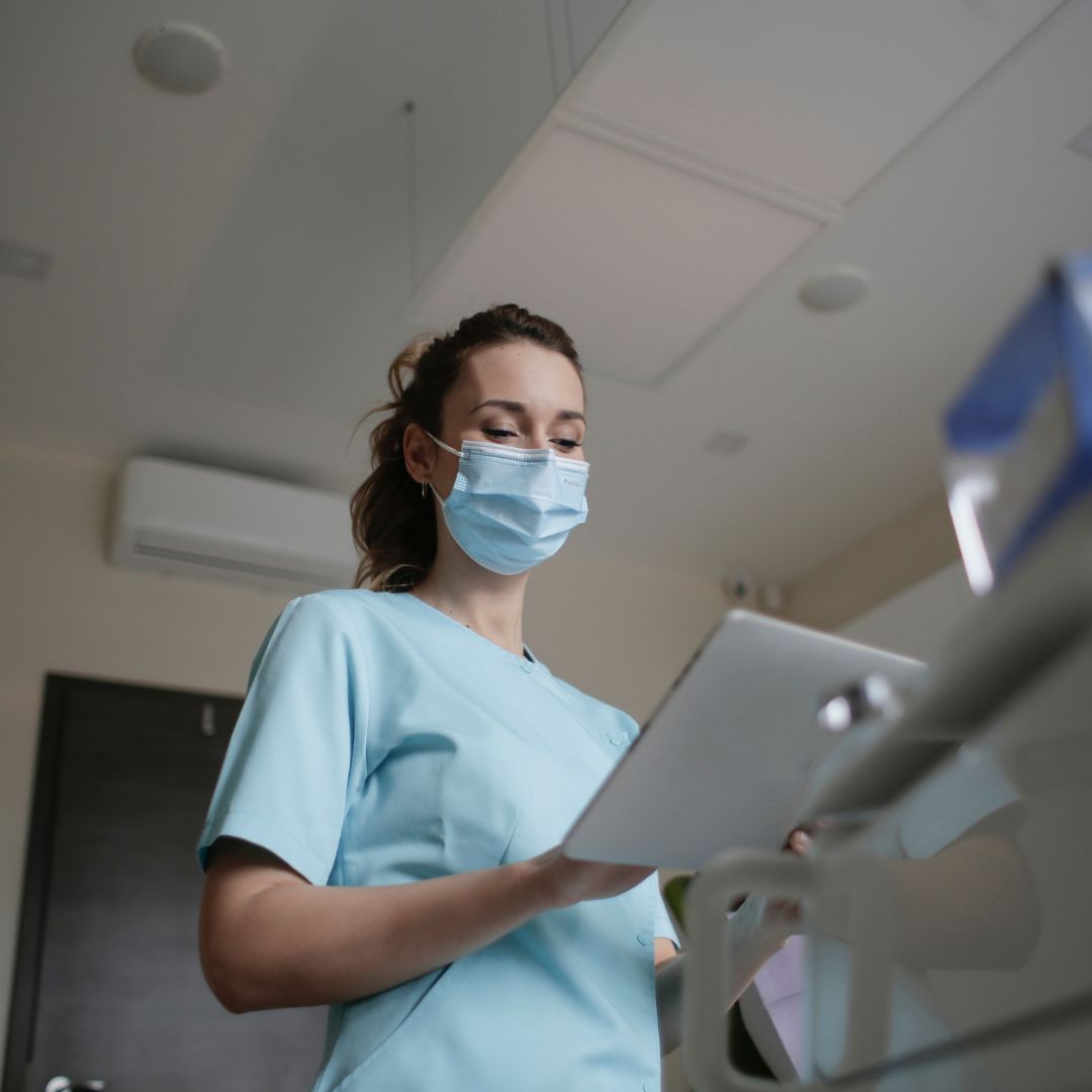 Image of a travel nurse looking at a tablet