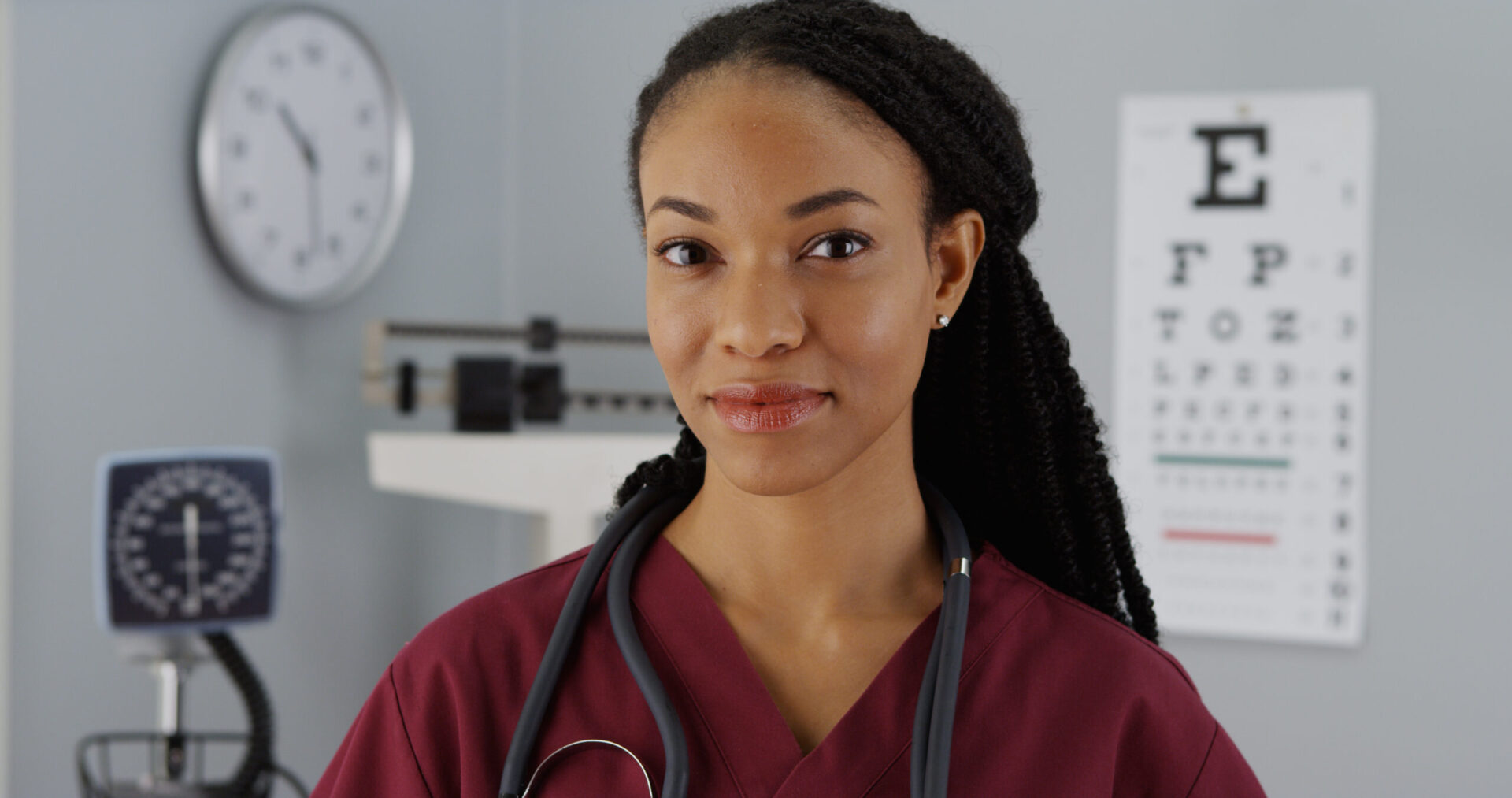 Successful Black woman doctor smiling at camera