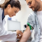 Image of a man getting his blood drawn