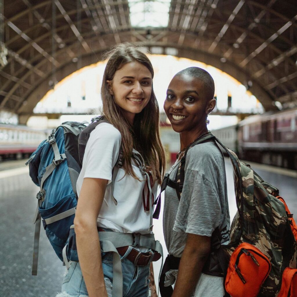 two travel nurses with backpacks